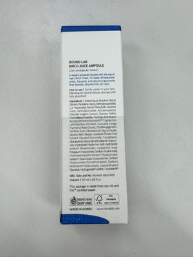 ROUND LAB ampoule in hand being applied, illustrates layering without residue