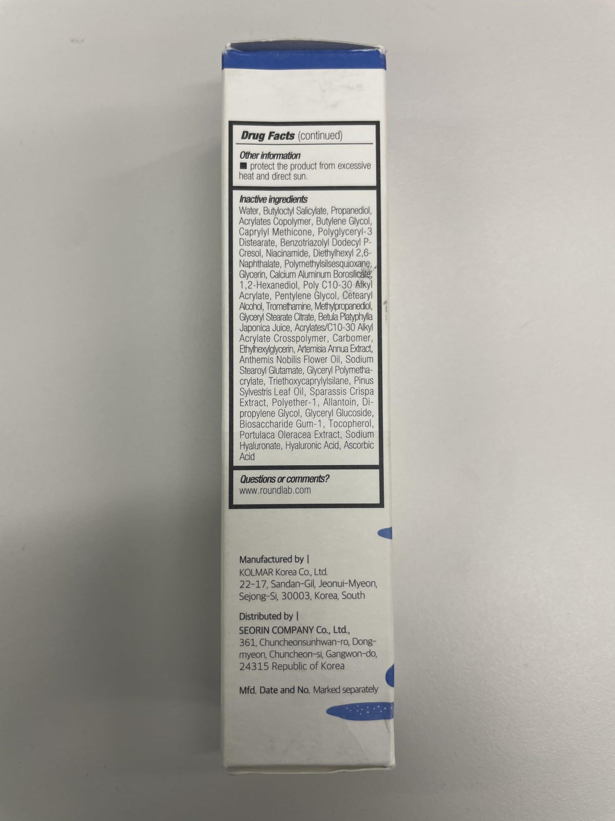 ROUND LAB compact bottle in a travel bag for on-the-go protection