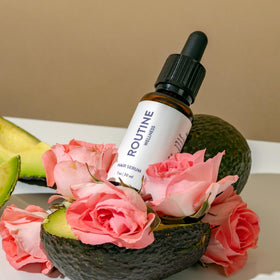 Routine Wellness lifestyle on bathroom vanity conveying easy daily use ritual