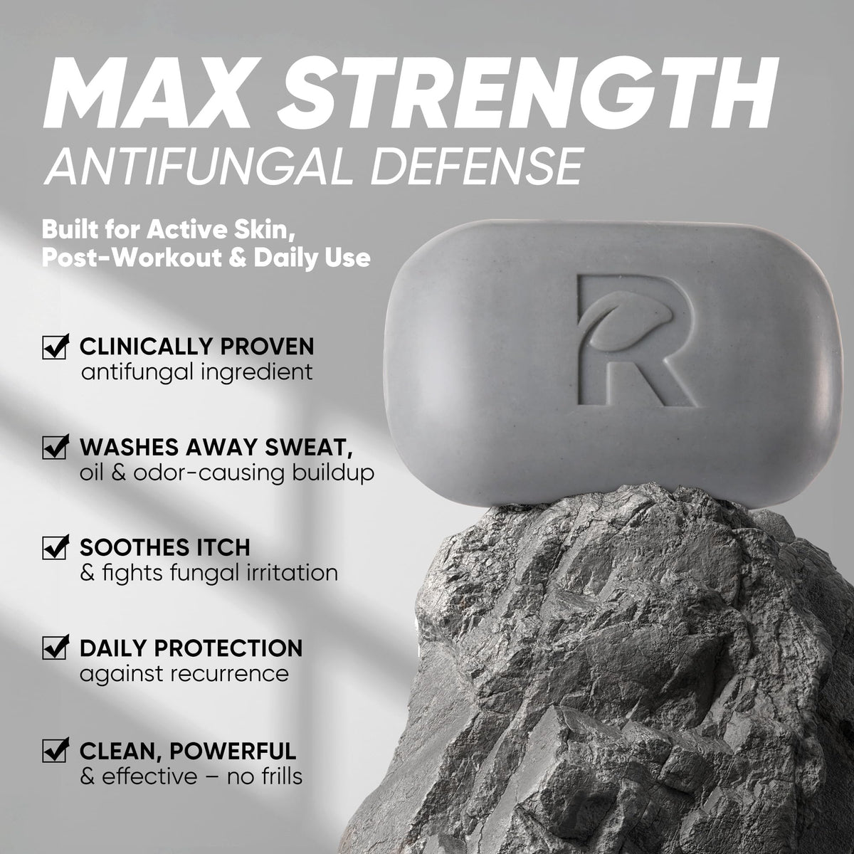 Roycederm bar close-up texture highlighting activated charcoal and gentle lather benefit