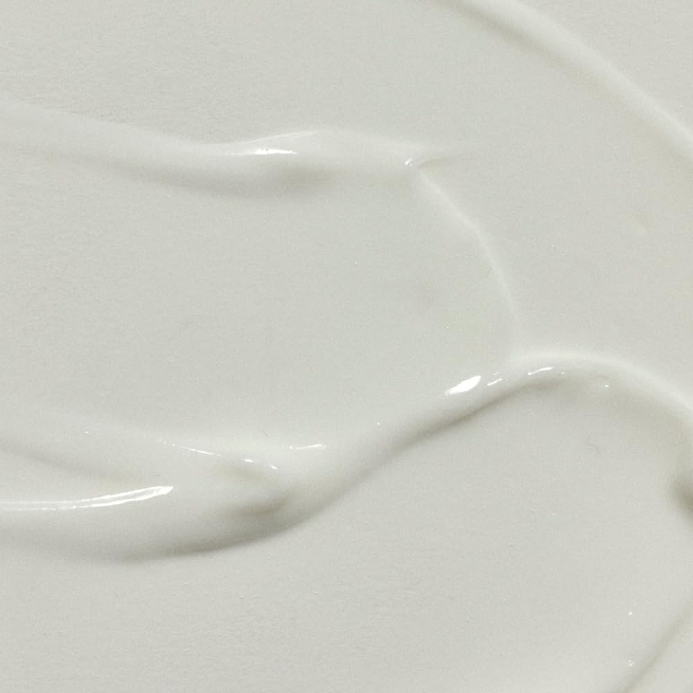 RŌZ milky serum texture swirled to show lightweight hydration effect