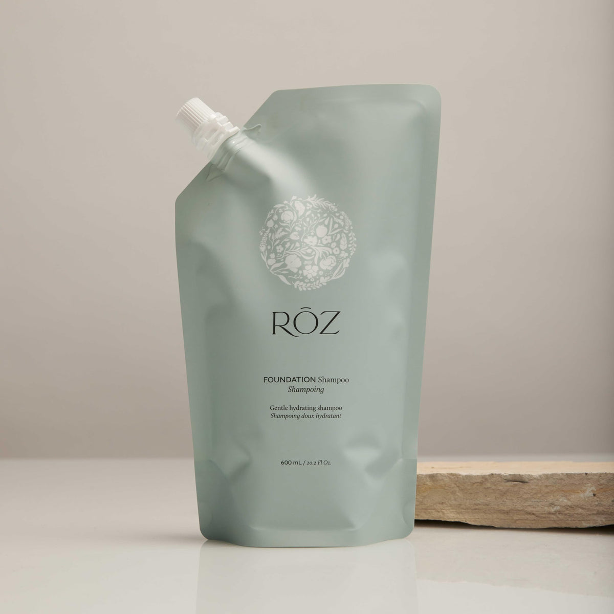 RŌZ refill pouch back label close-up displaying ingredients and directions, clarity benefit