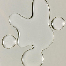RŌZ Santa Lucia oil texture on skin illustrating lightweight, non-greasy absorbency.