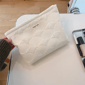 RSRSLEII held in hand with toiletries to show portable travel convenience