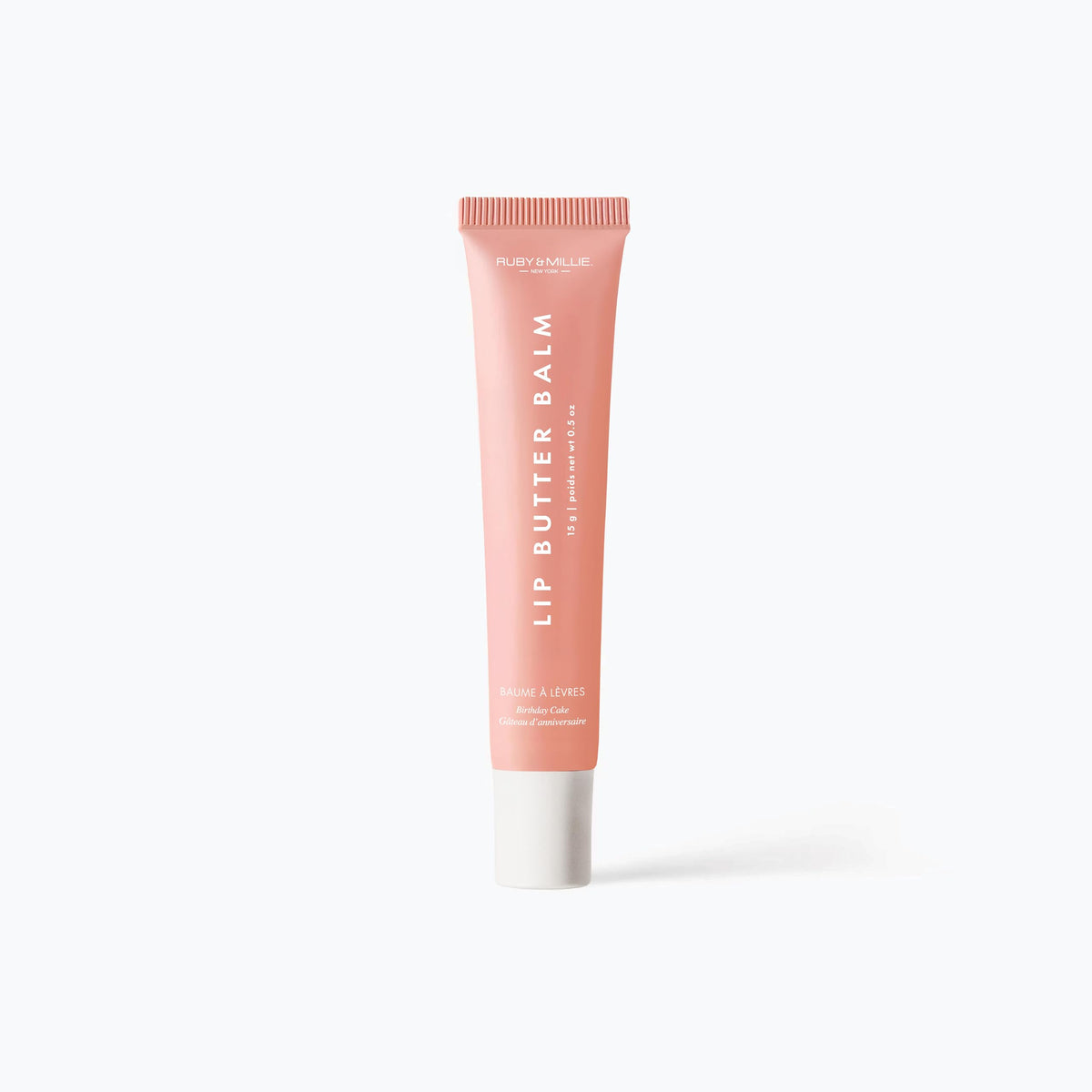 Ruby & Millie lip balm in hand showing pocketable size and convenient portability