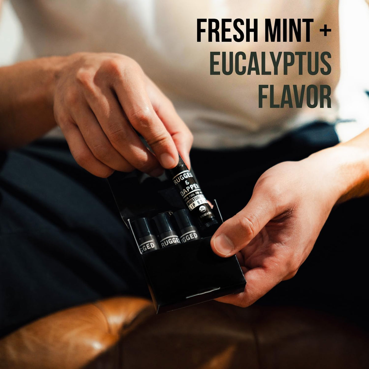 RUGGED & DAPPER tubes beside a wallet showing scale and travel-ready convenience