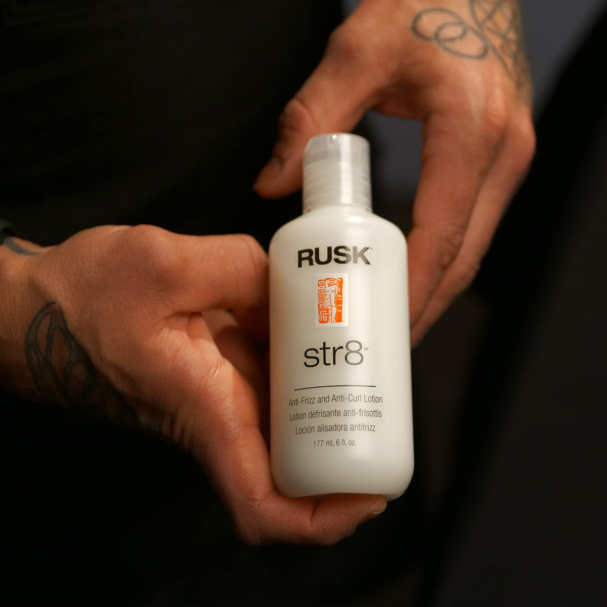 RUSK lotion texture close-up on hand, demonstrates lightweight greaseless consistency