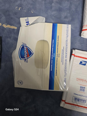 Safeguard bar resting on a ventilated soap dish for longer lasting use