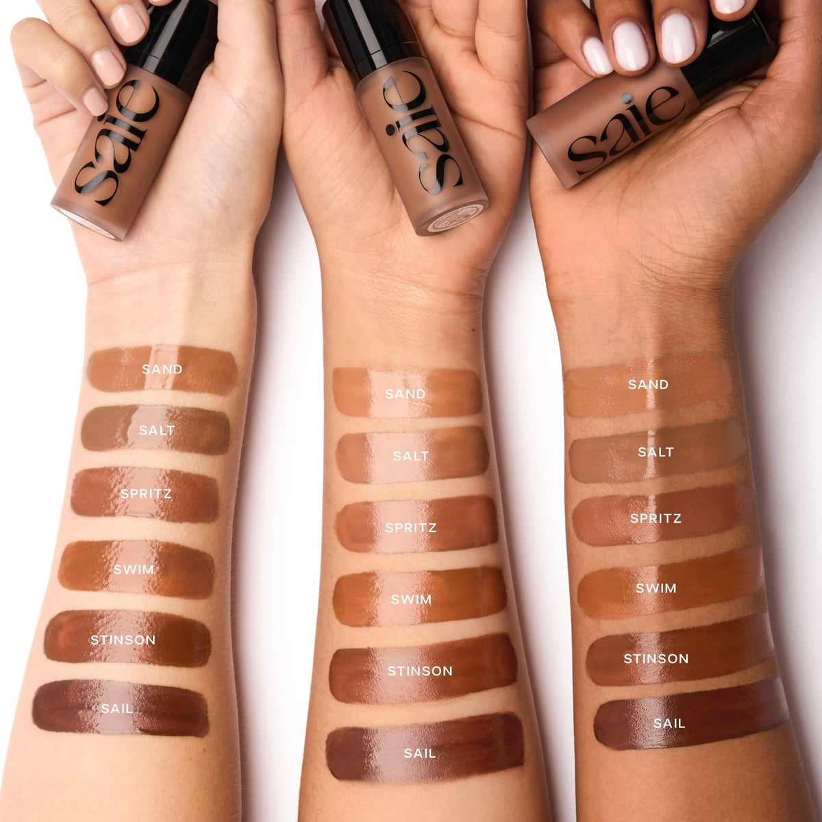 Saie Dew Bronze 'Salt' shade swatches on neutral surface to compare undertone and intensity