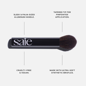 Saie Fluffy Brush tapered tip close-up for precise powder placement benefit