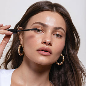 Saie mascara 101 applied during morning routine for lifted, bold lashes