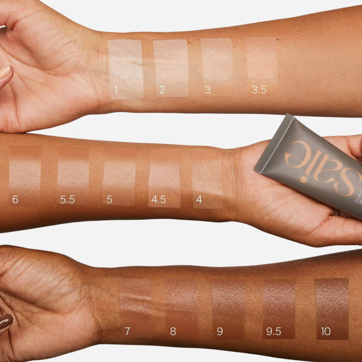 Saie Slip Tint swatch on arm in Shade Three + Half showing golden undertone