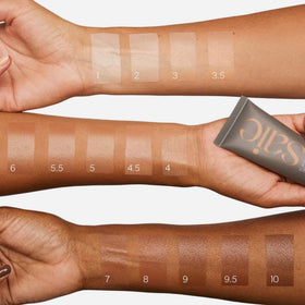 Saie Slip Tint swatch on arm in Shade Three + Half showing golden undertone