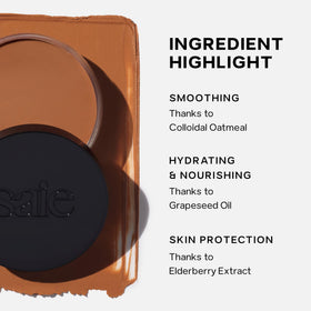 Saie Sun Melt next to a hand to show compact size and travel-friendly benefit