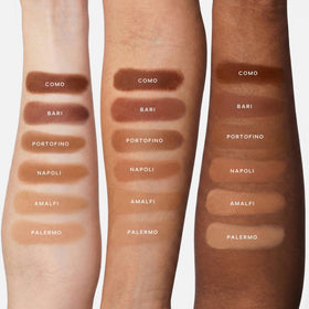 Swatch of Saie SuperSuede Amalfi on arm demonstrating buildable colour and soft radiance