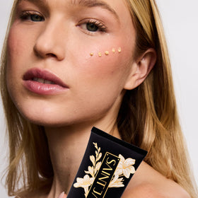SAINT JANE tube on vanity in styled bathroom, luxury daily ritual benefit