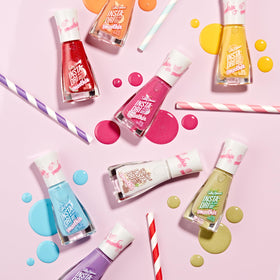Sally Hansen bottle in summer scene conveying fast-dry polish for on-the-go use