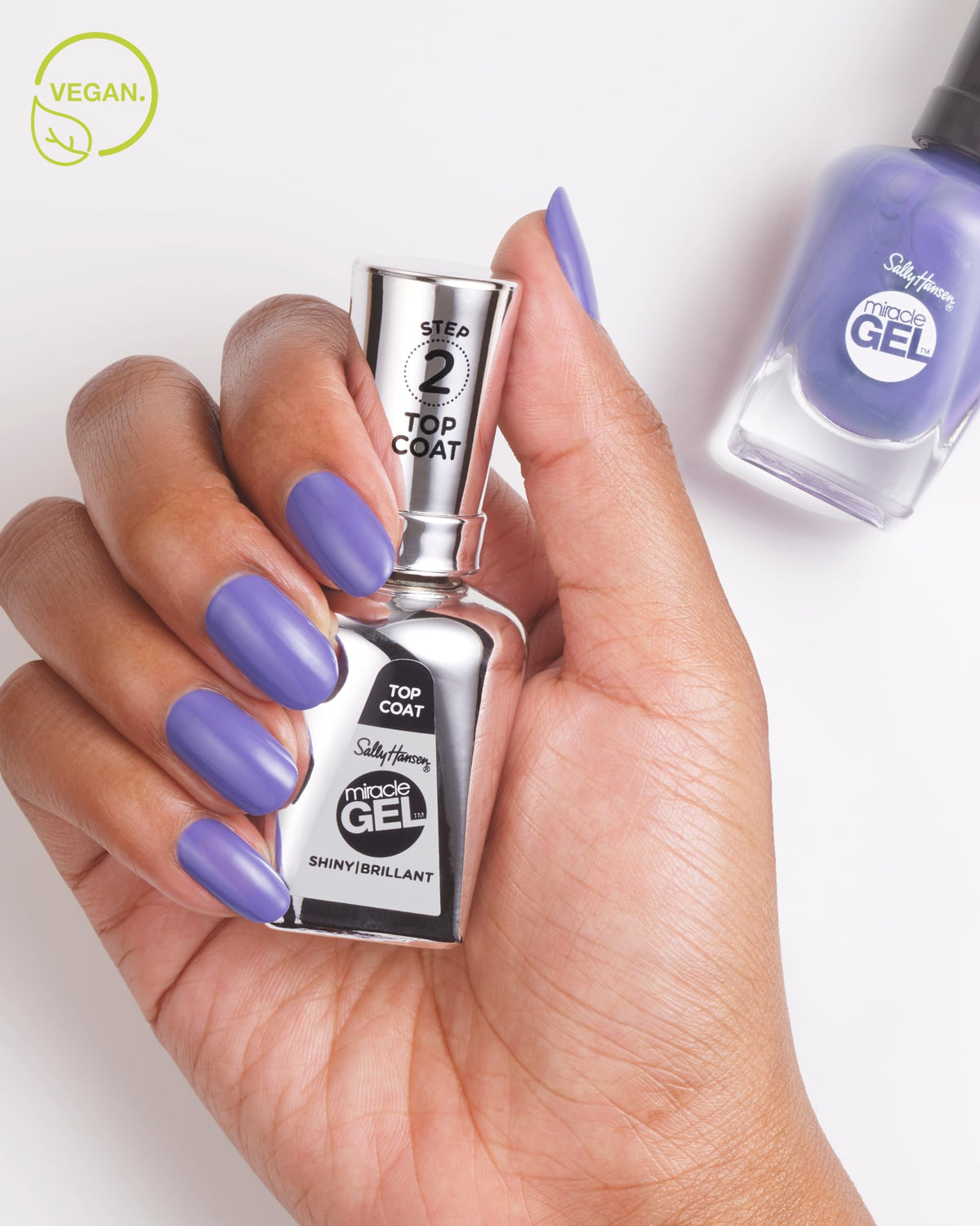 Sally Hansen glossy nails in use highlighting long-lasting high-shine benefit