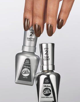 Sally Hansen bottle held in hand to show size and easy-at-home salon benefit