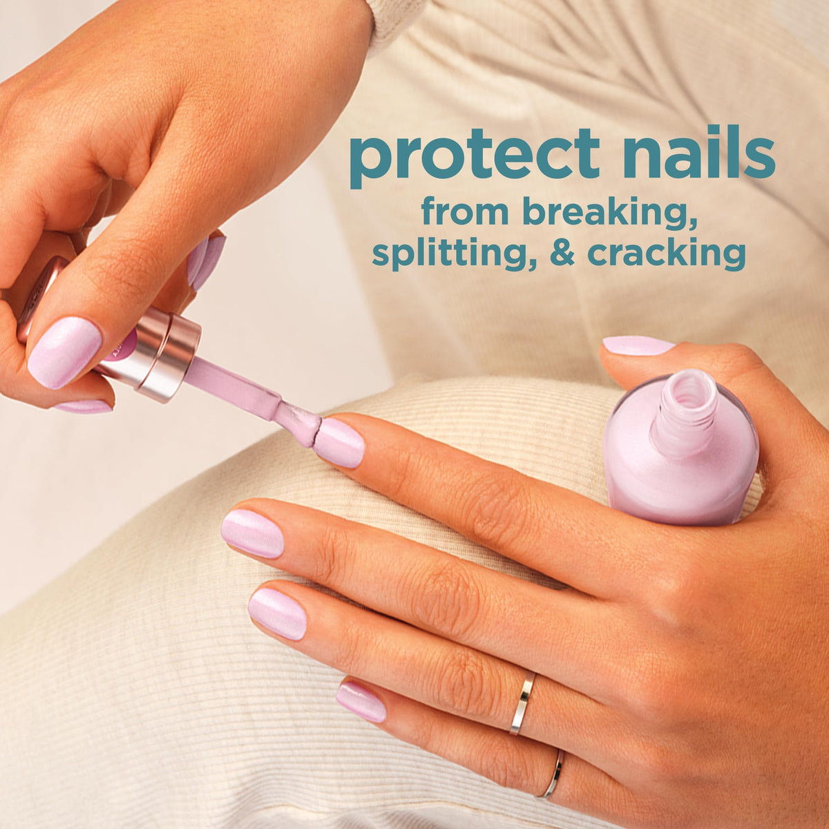 Sally Hansen on fingernails in lifestyle setting showing a neat, conditioned manicure