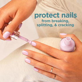 Sally Hansen on fingernails in lifestyle setting showing a neat, conditioned manicure