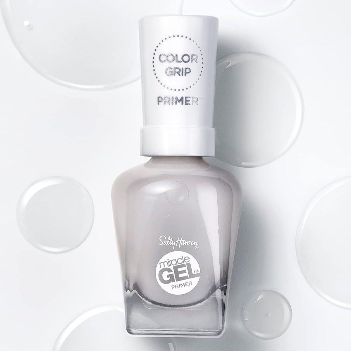 Sally Hansen primer in a manicure setting demonstrating glossy finished nails benefit