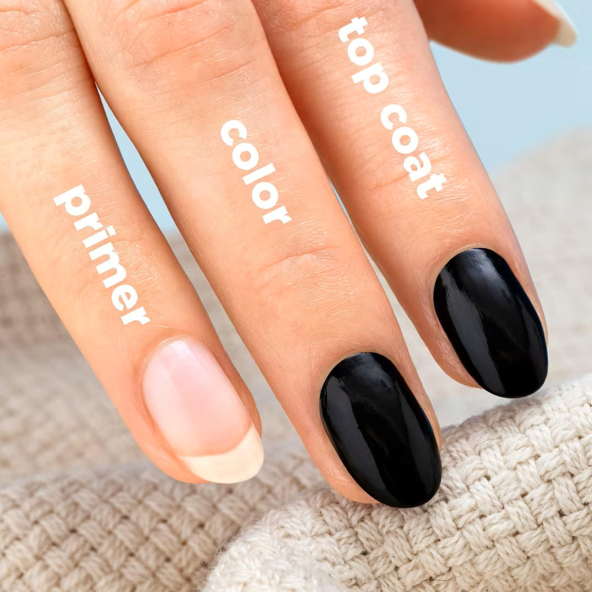 Sally Hansen primer held in hand to show bottle size and easy at-home use