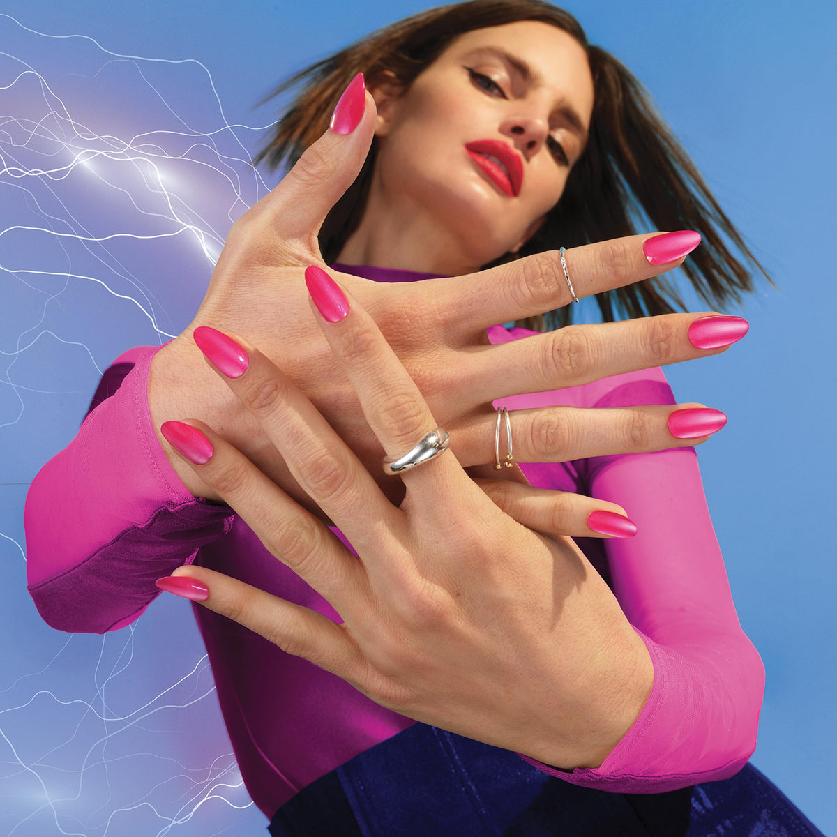 Sally Hansen bottle held next to hand showing scale and easy two-step routine benefit