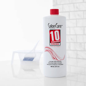 Stylist applying Salon Care developer in salon showing professional-use reliability