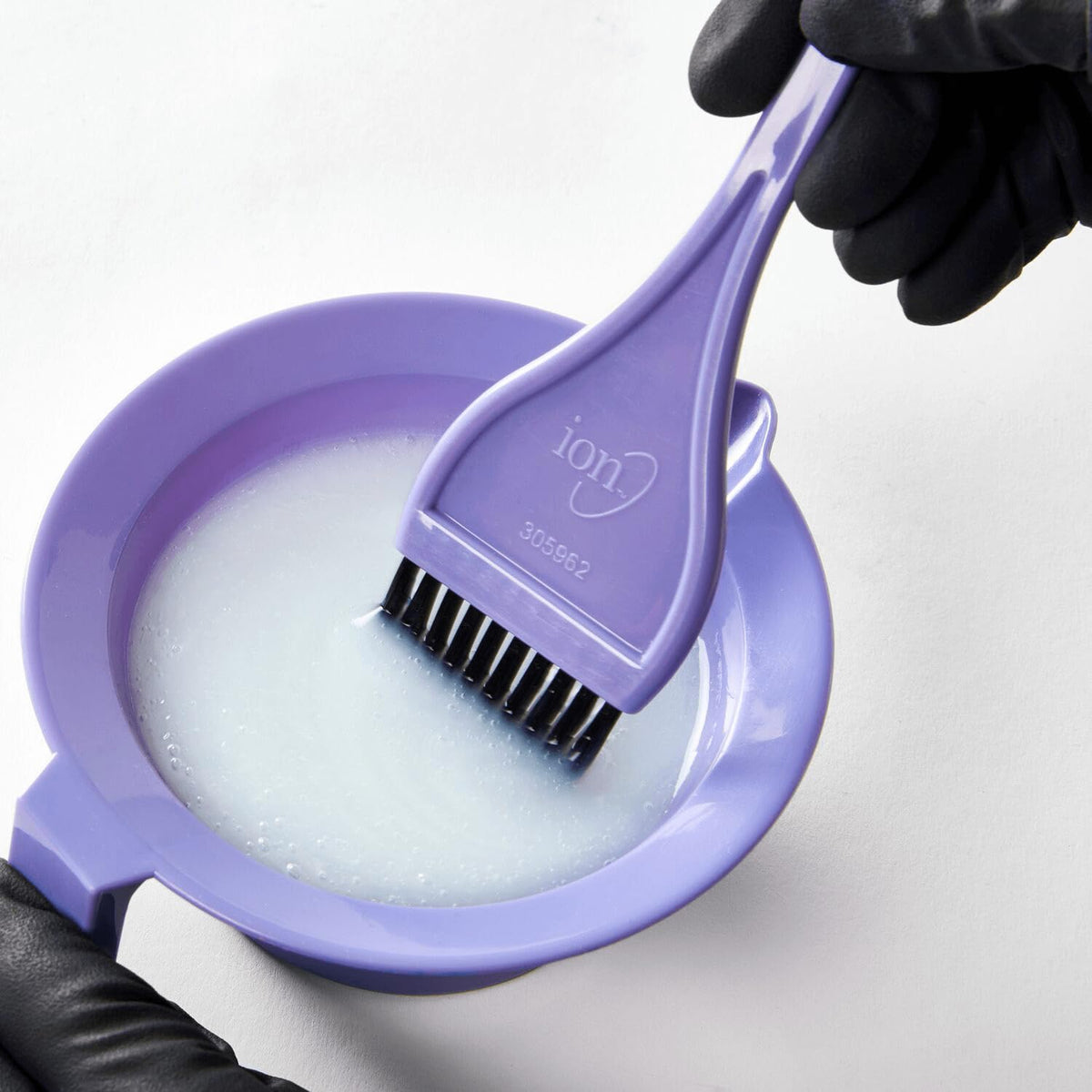 Salon Care bottle next to color tube illustrating compatibility and prep benefit