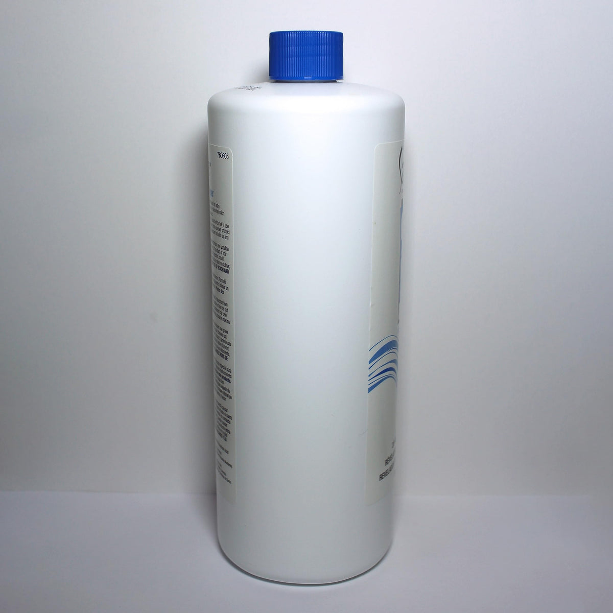 Salon Care 32 ounce bottle next to a ruler for size comparison and value benefit