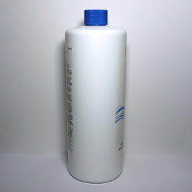 Salon Care 32 ounce bottle next to a ruler for size comparison and value benefit