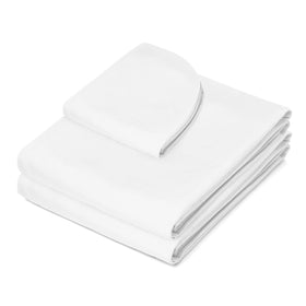 Saloniture fitted sheet snug on massage table demonstrating secure fit and quick setup