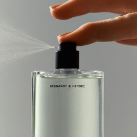 Salt & Stone mist on clothing in lifestyle scene for travel-friendly freshness