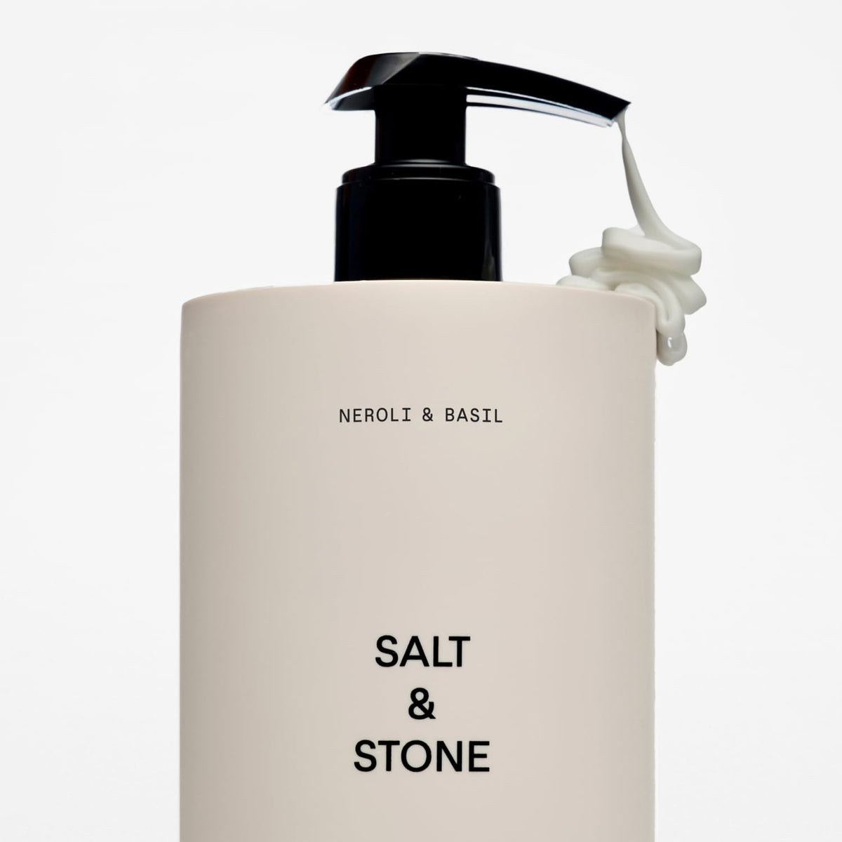 Salt & Stone bottle on bathroom shelf suggesting daily use and fresh scent