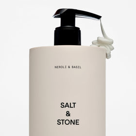 Salt & Stone bottle on bathroom shelf suggesting daily use and fresh scent