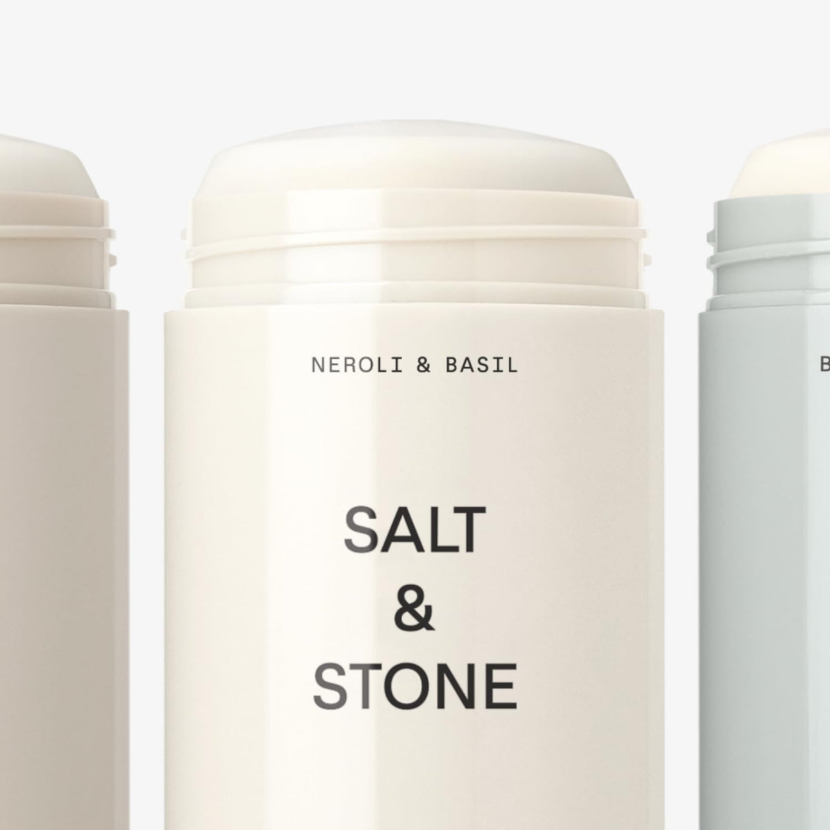 Salt & Stone deodorant next to a hand showing size and portable convenience