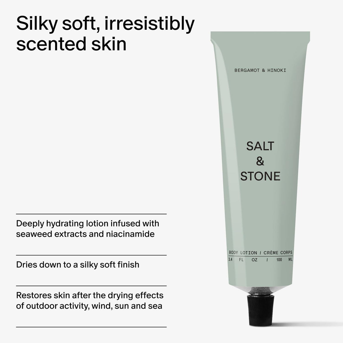 Salt & Stone bottle next to smartphone to show travel-friendly size