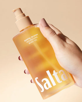 Saltair oil applied to damp skin after shower, illustrating fast absorption and long-lasting moisture