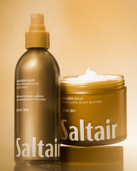 Saltair bottle held in hand for scale showing generous 8oz size and travel ease
