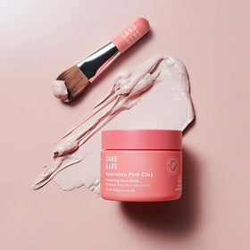 Sand & Sky applicator brush spreading mask demonstrating even, mess-free use benefit