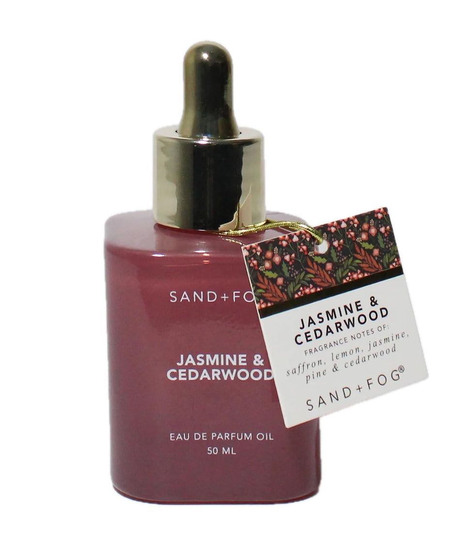 Sand + Fog front bottle of jasmine and cedarwood perfume oil, elegant vanity display