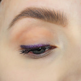 Sandstone Scandinavia eye look created with the pencil showing defined metallic purple eyeliner