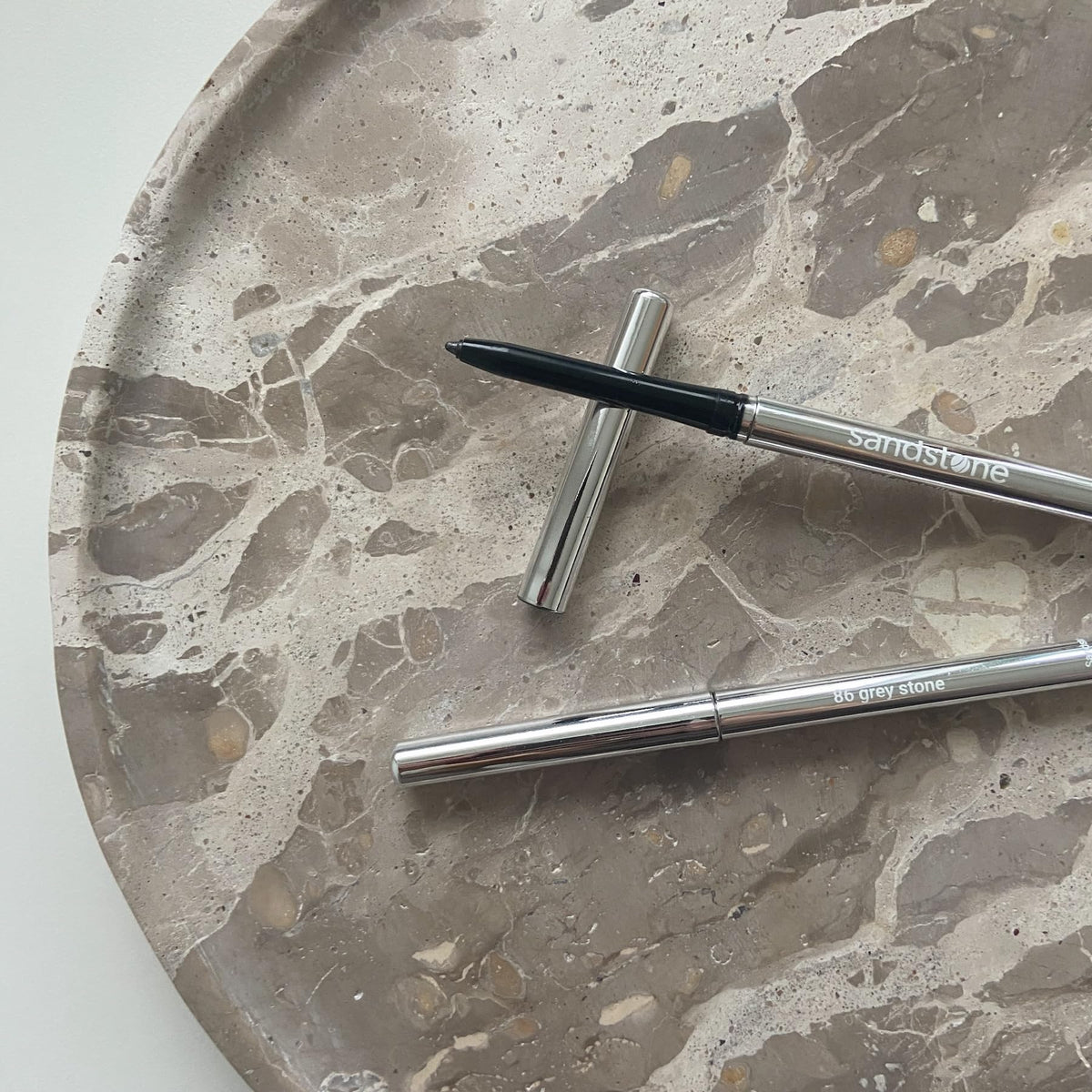 Sandstone Scandinavia pencil on vanity with brushes showing everyday wear convenience benefit