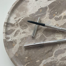 Sandstone Scandinavia pencil on vanity with brushes showing everyday wear convenience benefit
