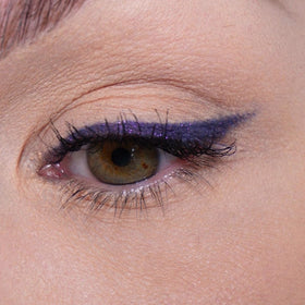 Sandstone Scandinavia swiped stroke on skin showing rich purple metallic payoff and blendability
