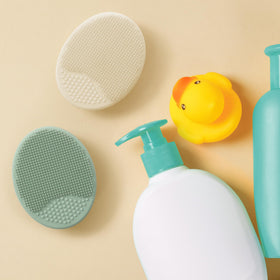 S&T INC. brush in use during baby bath providing soothing scalp massage
