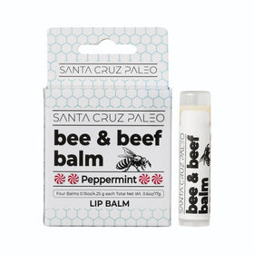 Santa Cruz Paleo lip balm held in hand to show compact size and portability benefit