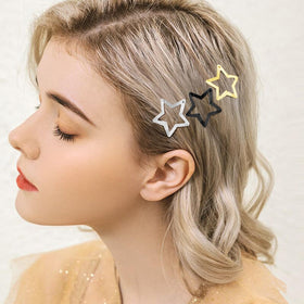SAOROPEB model wearing star clips at a festival for stylish accent