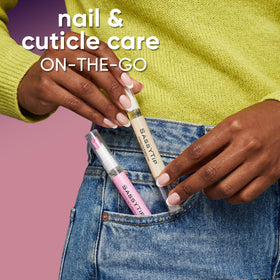 SASSYTIP pen next to coin showing compact size for on-the-go use